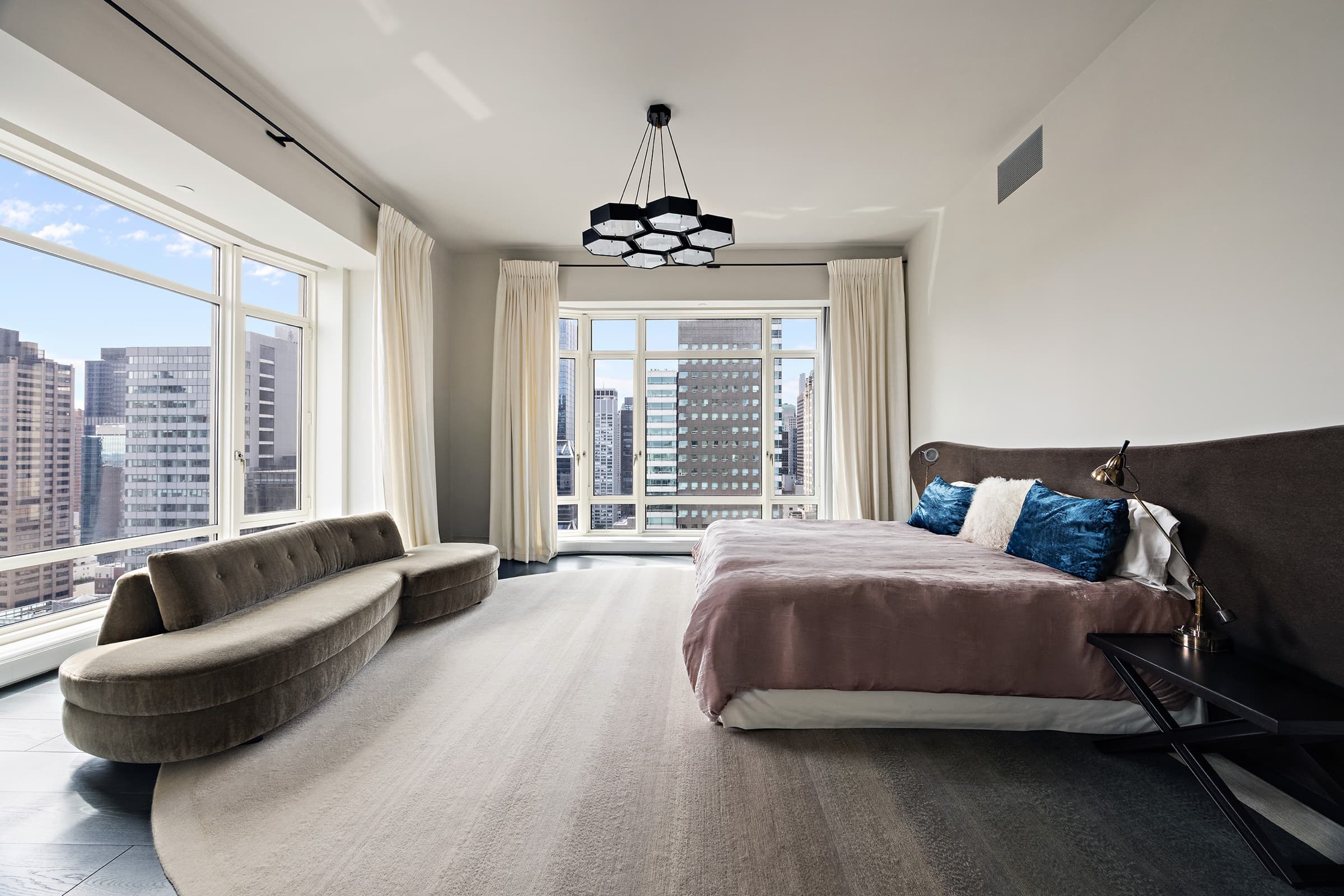 The same bedroom after editing: natural brightness, clean whites and a clear view through the windows